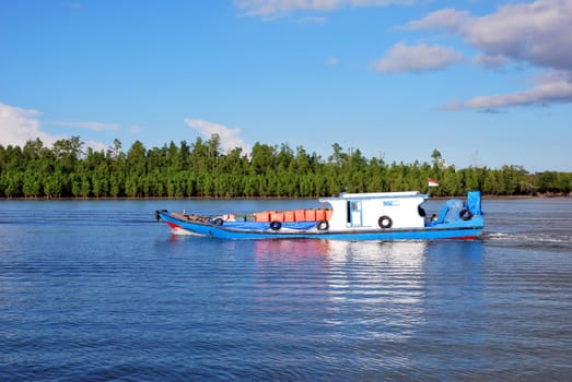 wooden boat with a Indonesian's flag on the high seas