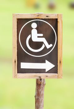 wood sign for invalid person entry in the park