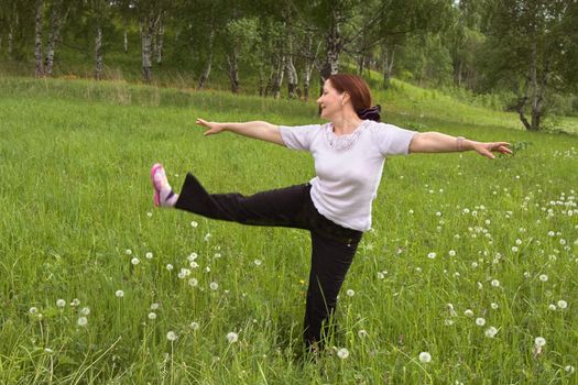 Women 50 years of gymnastics on the nature