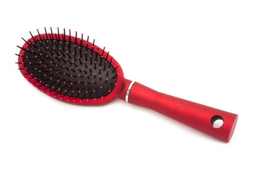 Red hairbrush - it is isolated on a white background