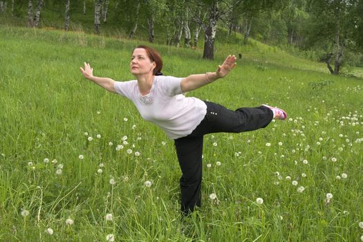 Women 50 years of gymnastics on the nature