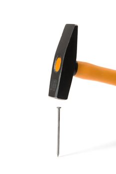 Hammer and nail - it is isolated on a white background
