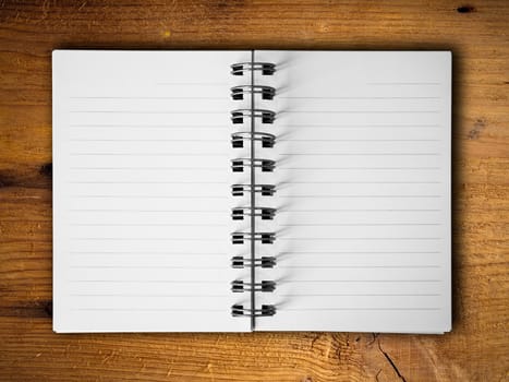 Open two blank white note book horizontal on teak wood background