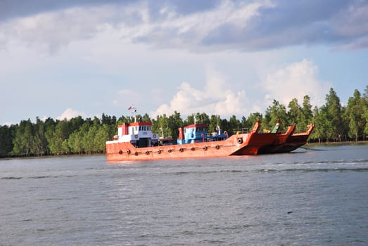 red barge  with Indonesia flag on the high seas