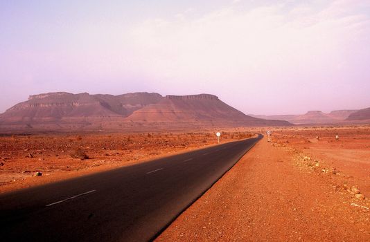 empty road in the sahara desert in mauritania