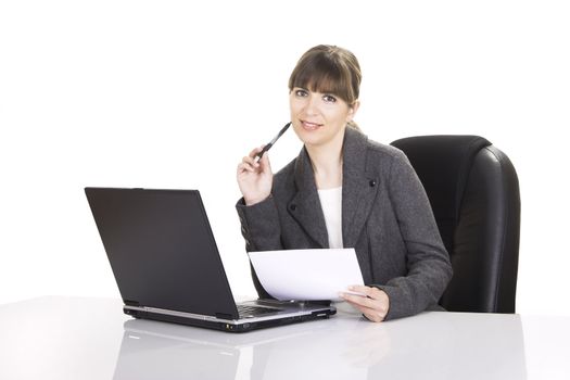 Beautiful business woman working with a laptop on a white background