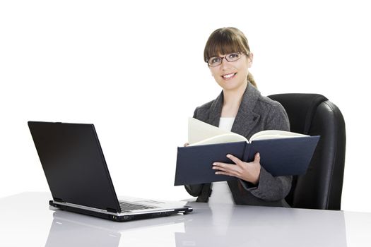 Beautiful business woman working with a laptop on a white background