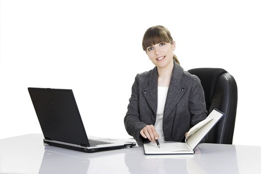 Beautiful business woman working with a laptop on a white background