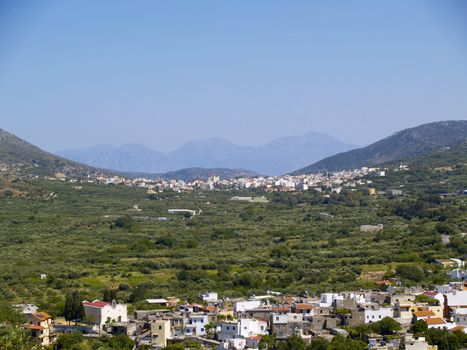 valley in rural cretan region, city of neapoli in the background