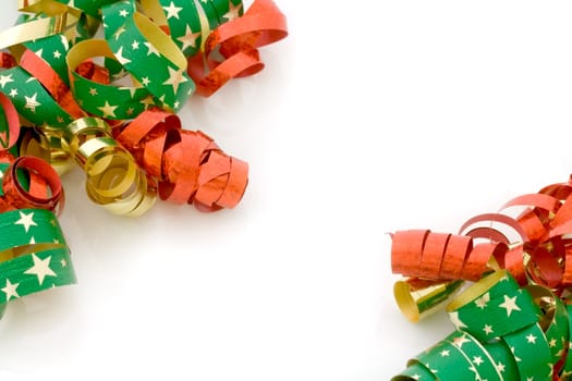 Red, golden and starry Christmas ribbons on white