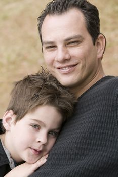 Portrait of a happy young man and a tired boy