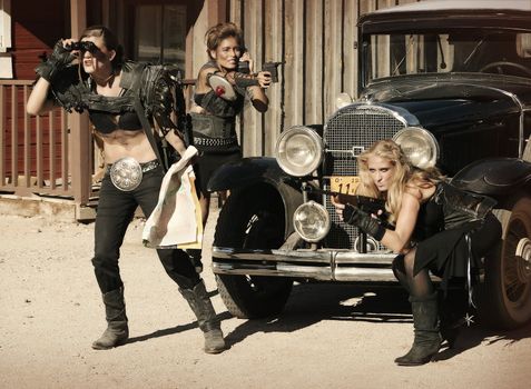 Three tough women engage in a shootout over a vintage car.