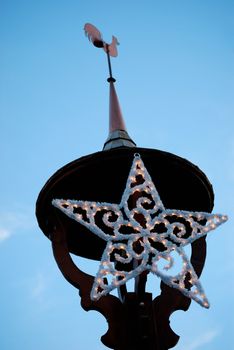 Dome with weathercock have Christmas decoration star. 