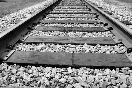 Railroad tracks seen in black and white