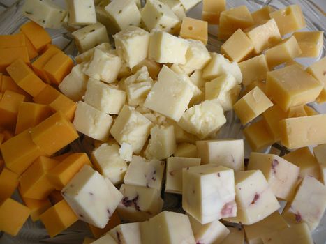 A plate of cubed cheeses