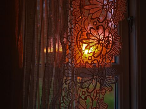Romantic view out of a room window with beautiful sunset      