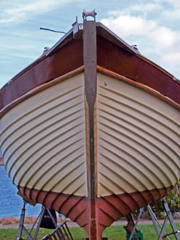 Details of the front part of a prow of a wooden yacht boat      