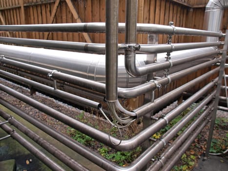 Industrial stainless steel metal pipes in a factory   