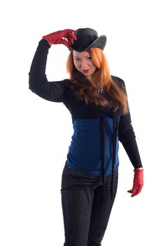 Young girl with red gloves and black hat standing on white background
