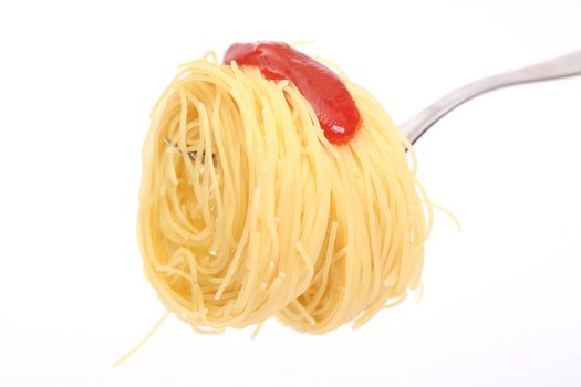 Spaghetti on a fork watered by ketchup