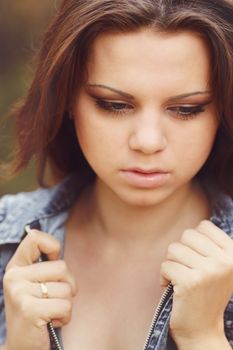 Beautiful Girl on a background a pine-wood