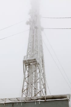 Radio transmitting tower frozen with a huge amounts of snow