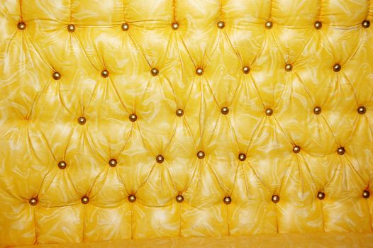 texture and pattern of yellow leather seat upholstery