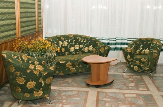 Sofa and two armchairs in an interior