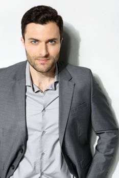 Young stylish man on a gray background