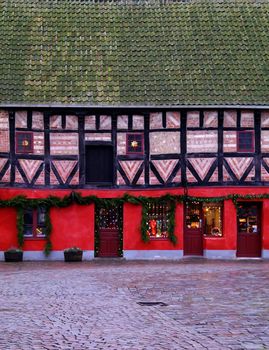 Old colorful building in Malm� with a with a shop at the ground level