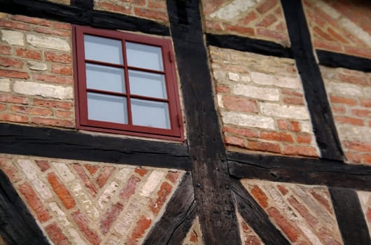 Old building in Malm� with a red window