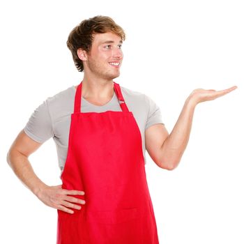 Apron man showing. Small business shop owner showing and looking wearing red apron. Happy smiling and proud caucasian man presenting isolated on white background.