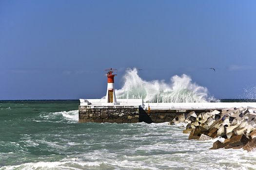 Lighthouse towers in the harbour in Cape Town. 
South Africa