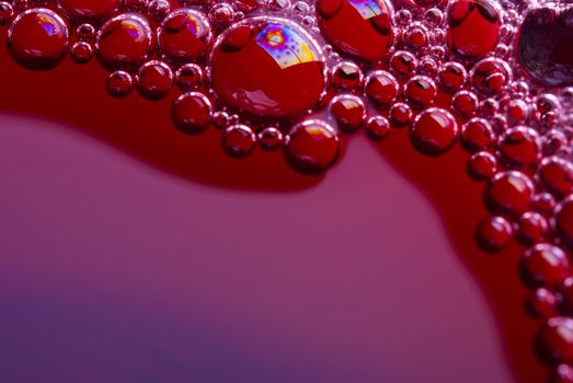 Bubbles of red wine from the different foreshortening  in glass