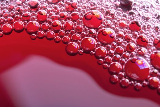 Bubbles of red wine from the different foreshortening  in glass