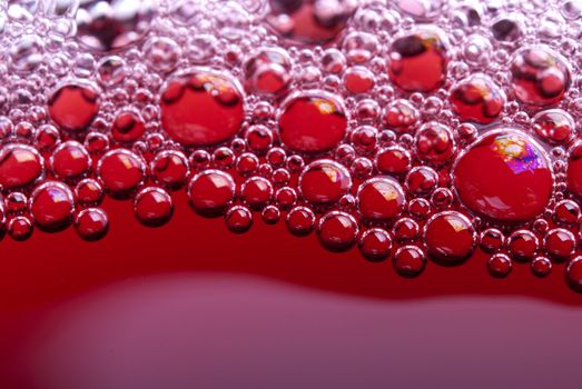 Bubbles of red wine from the different foreshortening  in glass