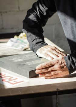 Painter artist working with hands on a oil canvas texture