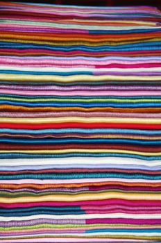 Number of colorful scarves put in a pile