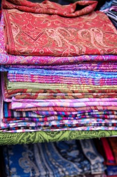 Number of colorful scarves put in a pile