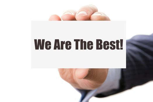 Hand holding card with inscription we are the best, isolated on white background