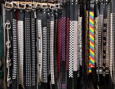 Number of studded belts in different shapes and colors