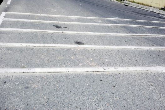 "sleeping police" bumps in the road pavement to reduce the rate of vehicles passing