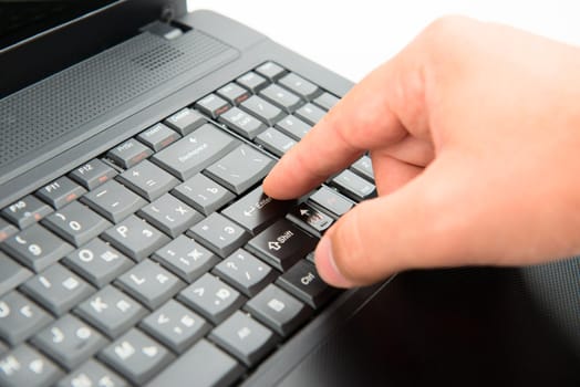 Hand on keyboard pushes button enter
