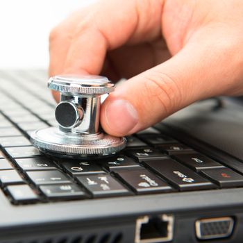 Concept of diagnostic. Stethoscope and laptop