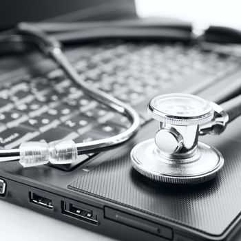 Concept of diagnostic. Stethoscope and laptop