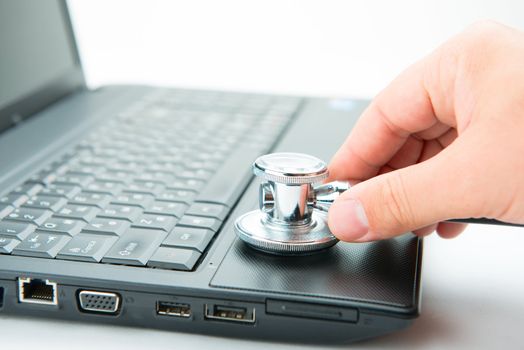 Concept of diagnostic. Stethoscope and laptop