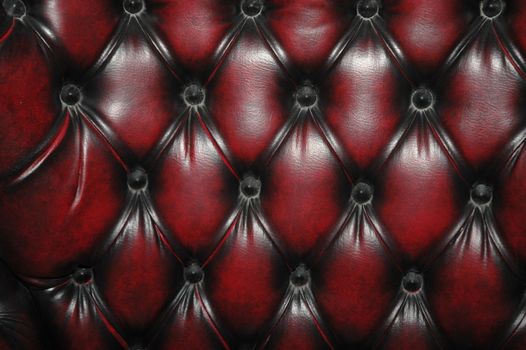 texture and pattern of red dark leather seat upholstery