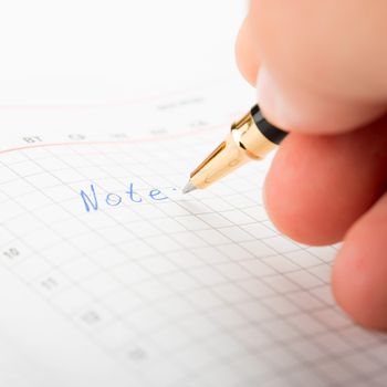 Businessman taking notes and planning in a meeting