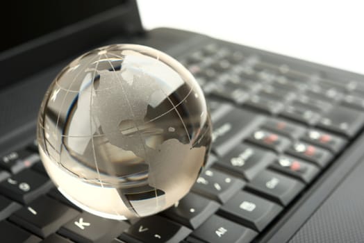globe on a laptop keyboard