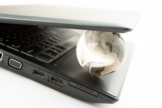 globe on a laptop keyboard